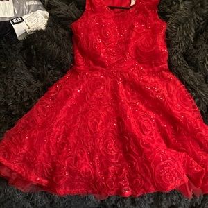 I am selling a red sparkly dress